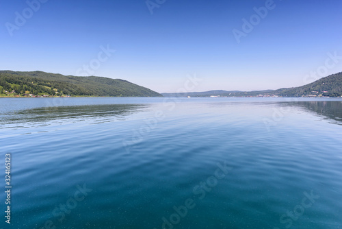 Lake Baikal close to village Port Baikal, Russia. Horizontal day view of the high shore and clear lake water