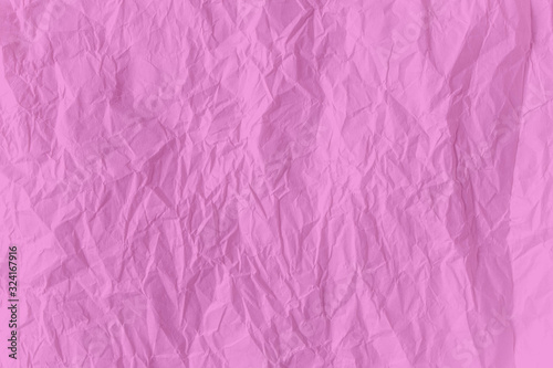 surface pink color crumpled paper close up texture background