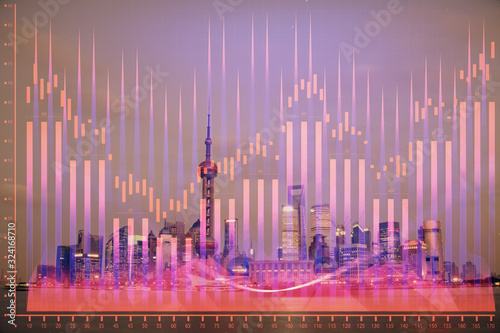 Forex chart on cityscape with tall buildings background multi exposure. Financial research concept. © peshkova