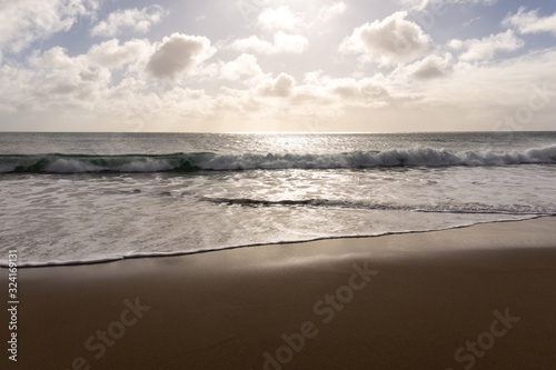 sunlit ocean beach