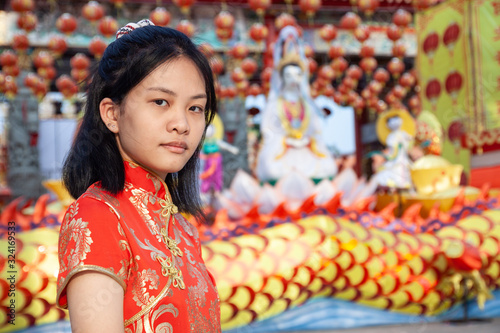 Portrait asian woman in Chinese national costume,  of Chinese New Year Celebration concept. © chaophrayaart