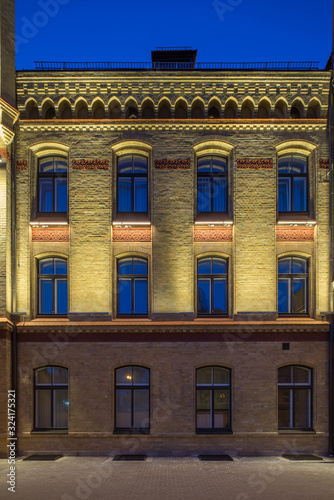 Modern city architecture. Night lighting of building in art Nouveau style. Riga, Latvia.