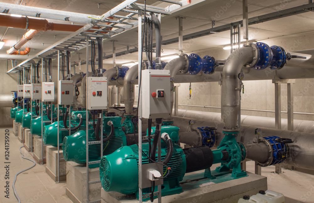 Interior of industrial water treatment and boiler room. Single-stage, low-pressure centrifugal pump. Heating system.