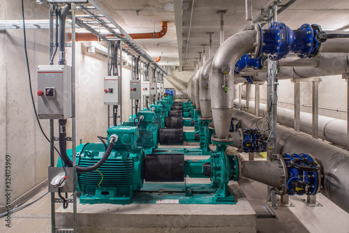 Interior of industrial water treatment and boiler room. Single-stage, low-pressure centrifugal pump. Heating system.