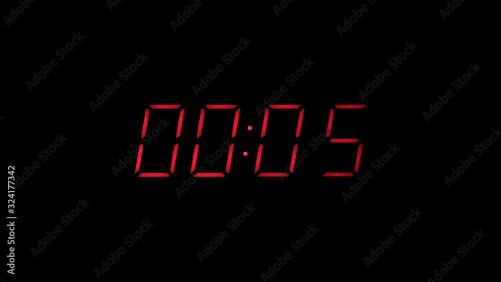 Red digital clock countdown to zero slow zoom in
