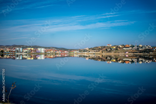 panorama of the city reflected at the lake