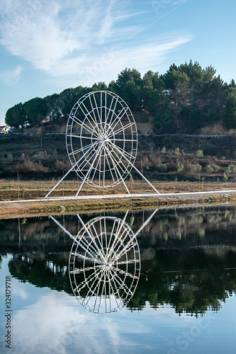 ferris wheel on background of blue sky
