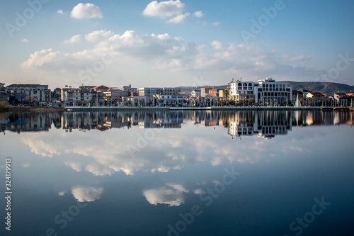 panorama of the city reflected at the lake