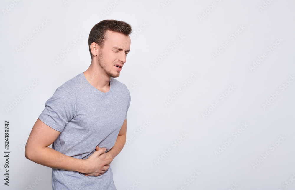 The man holds on to the gifhot, writhing in pain. The man holds on to the gifhot, writhing in pain.