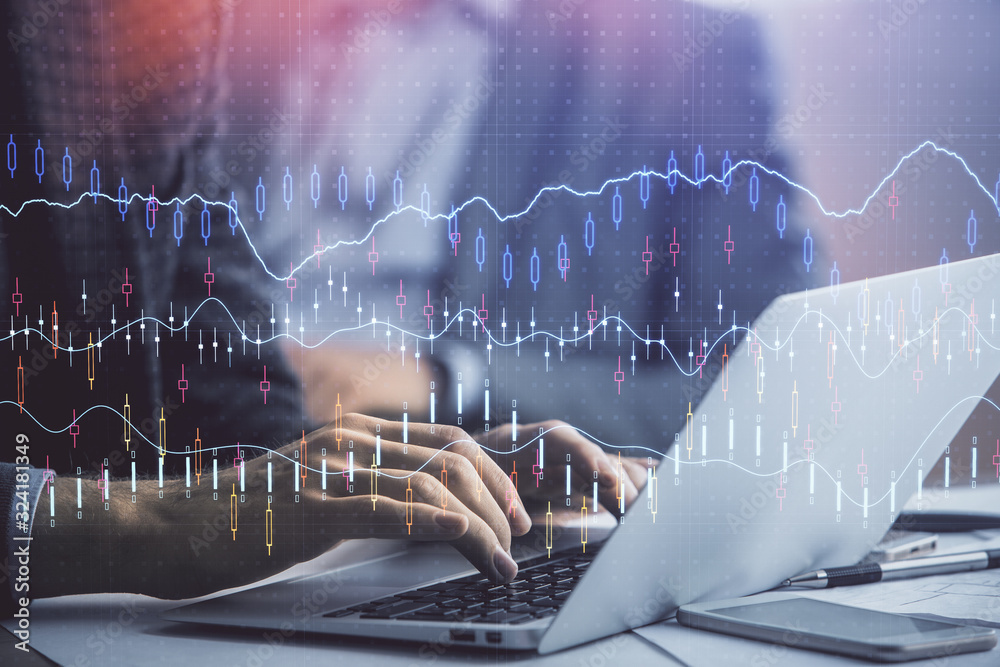 Double exposure of market chart with man working on computer on background. Concept of financial analysis. Double exposure of market chart with man working on computer on background. Concept of financial analysis.