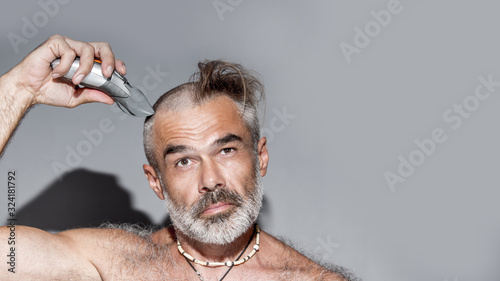 Fotografia, Obraz Handsome Man Half  Shaved by himself, before and after concept