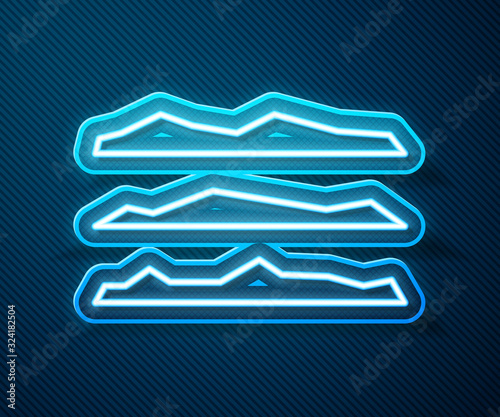 Glowing neon line Strips of cocaine or heroin drug icon isolated on blue background. Vector Illustration