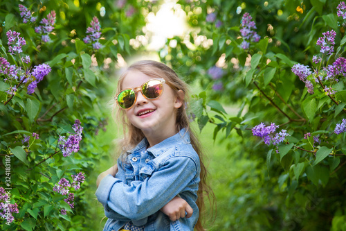 Cute smiling little girl in a park