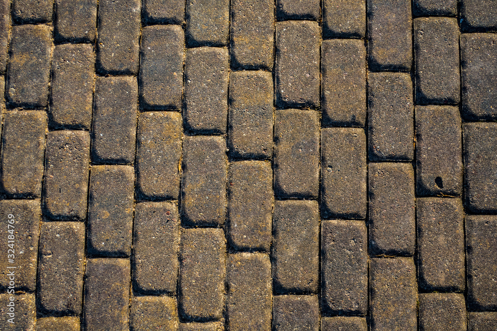 Brick stone paved road surface as texture background Brick stone paved road surface as texture background