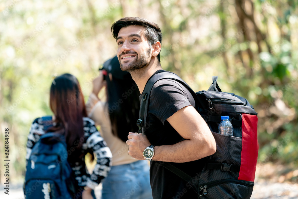 Travel Hiking Man Carrying a Backpack on the back and Walking in National Park.