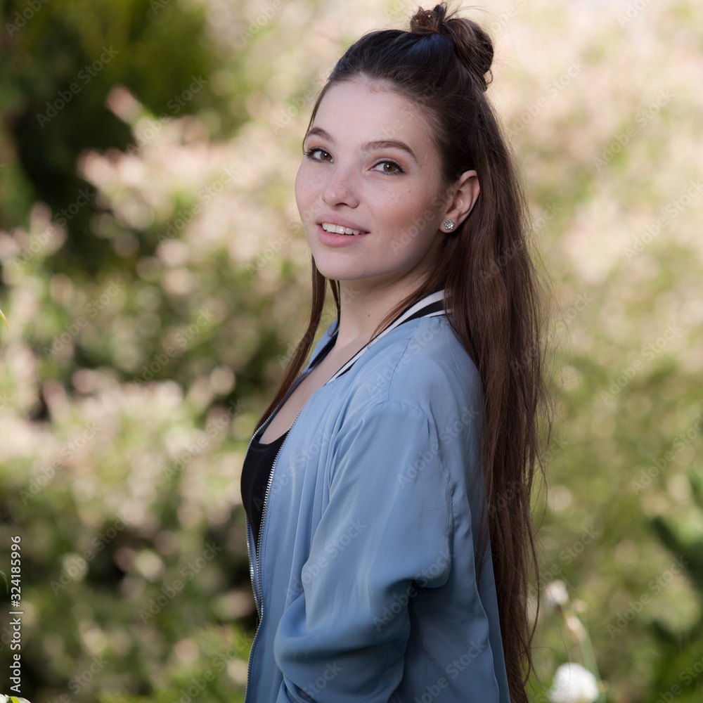 Portrait of beautiful young girl in summer garden. Portrait of beautiful young girl in summer garden.