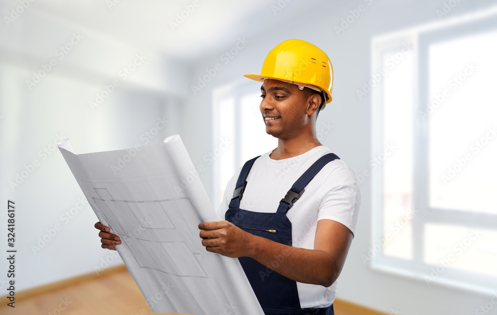 profession, construction and building - happy smiling indian builder in helmet with blueprint over empty room at new home or apartment background profession, construction and building - happy smiling indian builder in helmet with blueprint over empty room at new home or apartment background