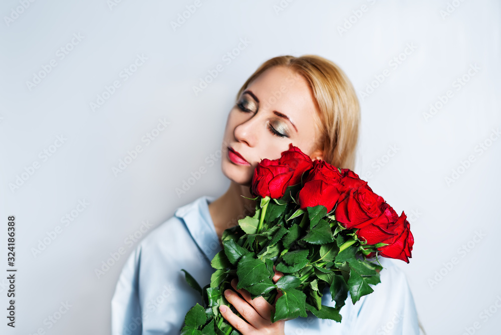 Blond woman with red roses Blond woman with red roses