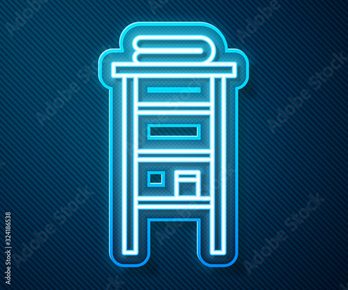 Glowing neon line Bathroom rack with shelves for towels icon isolated on blue background. Furniture object for bath room interior. Vector Illustration