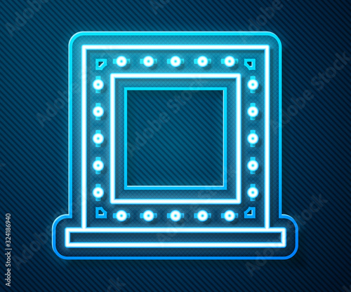 Glowing neon line Makeup mirror with lights icon isolated on blue background. Vector Illustration