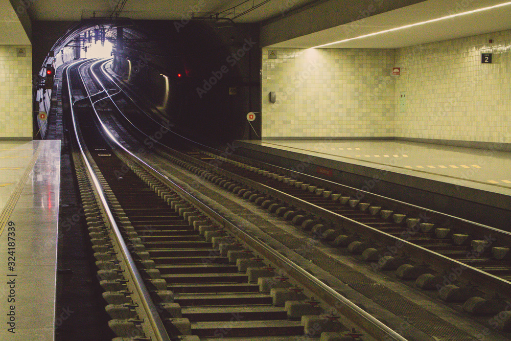 Empty subway station filtered. Underground platform. Railway in perspective. Urban transport concept. Travel background. Transportation concept. Subway line. 