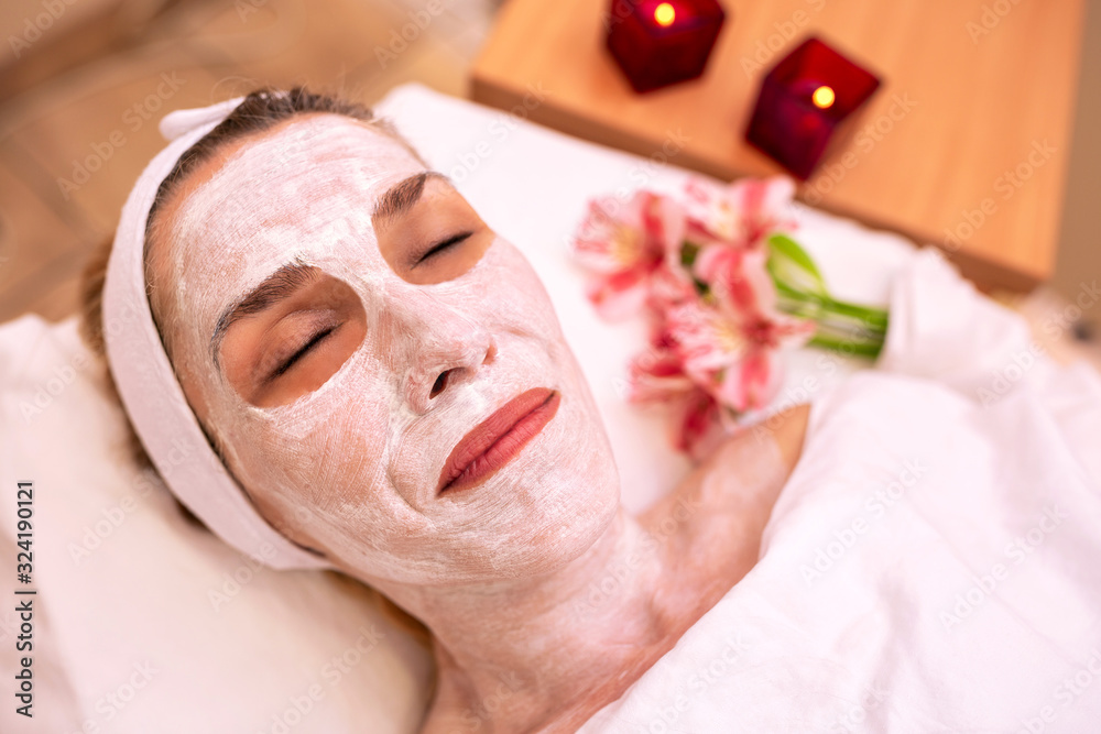 Beauty skin cosmetics treatment with flowers in background