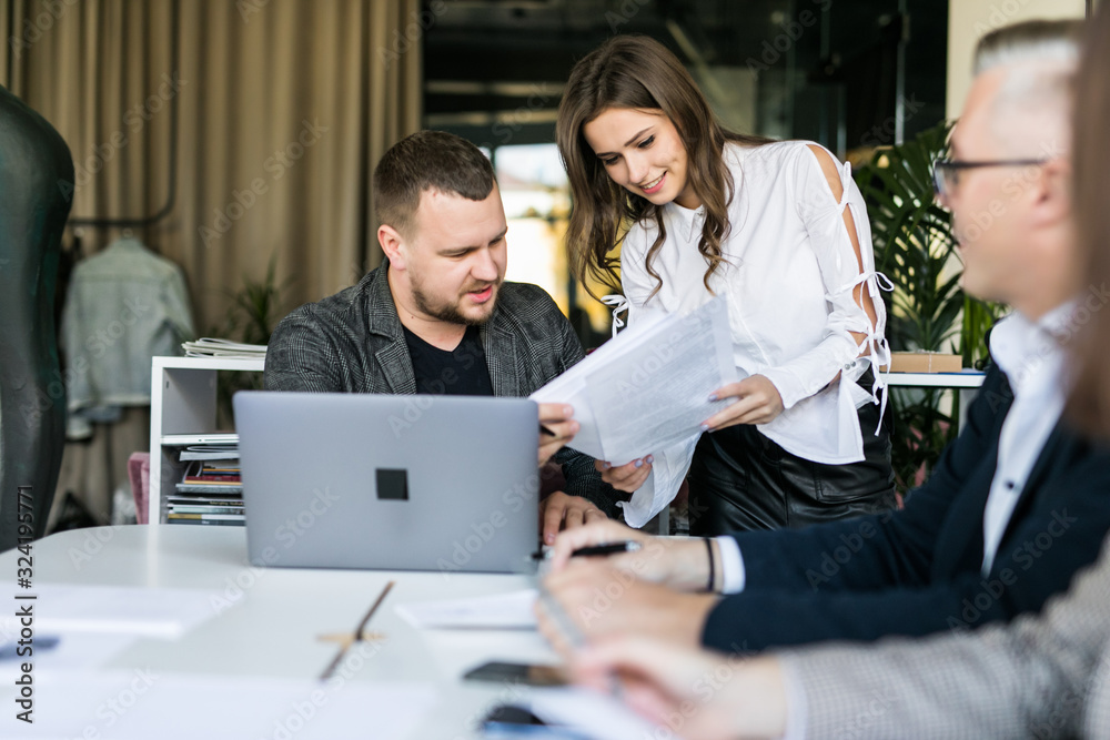 Business people showing team work while working in board room in office