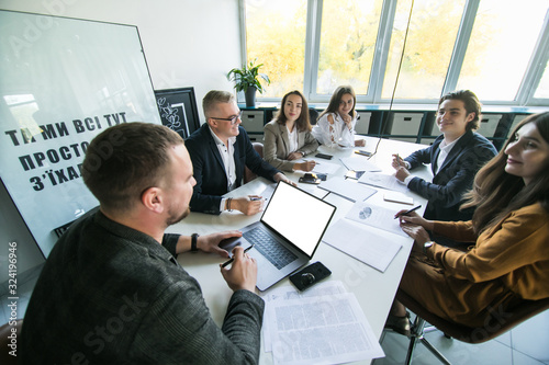 Tableau sur toile Group of young people in business meeting in office
