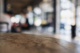 Closeup image of a concrete table with blur background in cafe