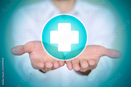 Close-up man in white shirt holding white first aid icon