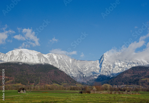 Winter landscape with beautiful high mountains in sunny day, in Styria region, Austria