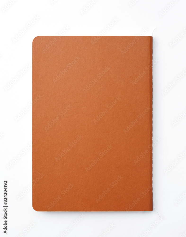 Top view of closed stitch blank recycled paper cover notebook on white background.
