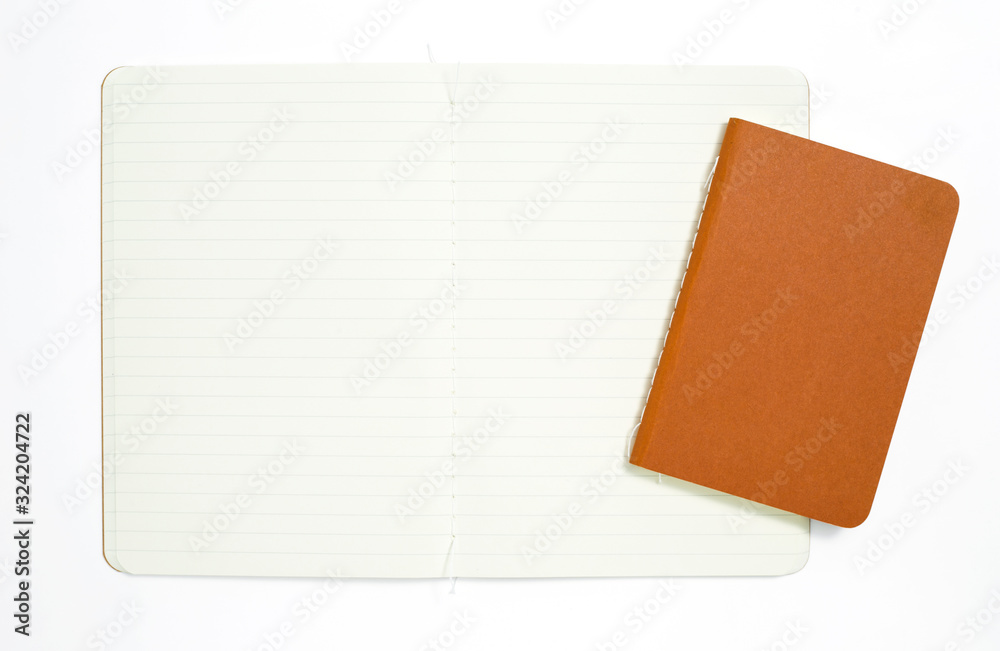 Top view of open stitch blank recycled paper cover notebook on white background.