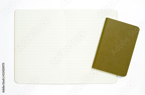 Top view of open stitch blank recycled paper cover notebook on white background.