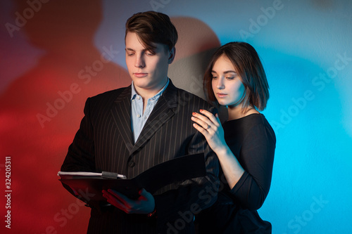 A girl and a man with a tab...