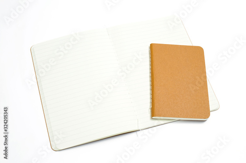 Top view of open stitch blank recycled paper cover notebook on white background.
