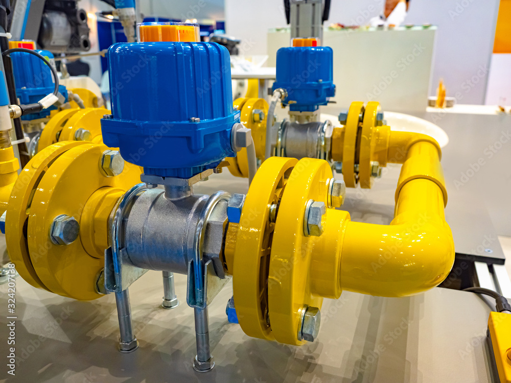 Gas industry. Yellow-blue pipes in the shop of the enterprise. Gas distribution equipment. Chemical industry. Control of supply of natural resources. Installation for gas pumping. Gas industry. Yellow-blue pipes in the shop of the enterprise. Gas distribution equipment. Chemical industry. Control of supply of natural resources. Installation for gas pumping.