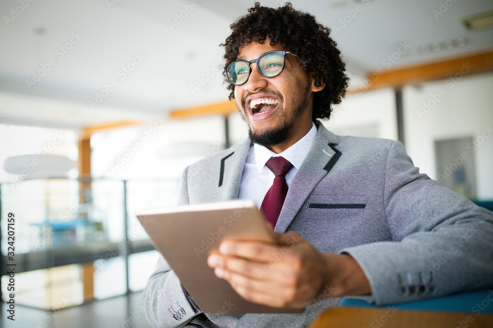 Portrait of man in office using tablet Portrait of man in office using tablet