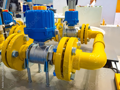 Gas industry. Yellow-blue pipes in the shop of the enterprise. Gas distribution equipment. Chemical industry. Control of supply of natural resources. Installation for gas pumping.