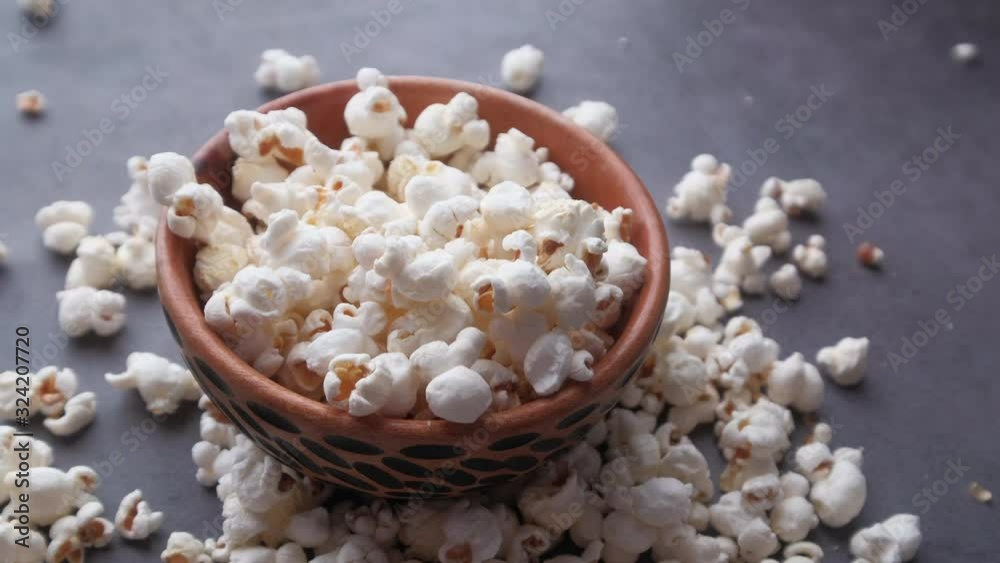 Close up of popcorn in a bowl on table Close up of popcorn in a bowl on table