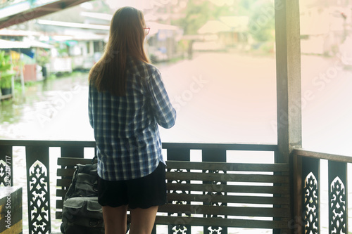 Women tourists travel in the market with a lot of people , tourism concep photo