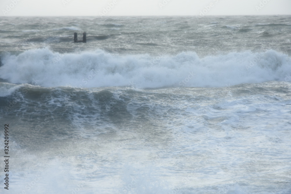 breakwaters on the Dutch coast during a storm with high waves