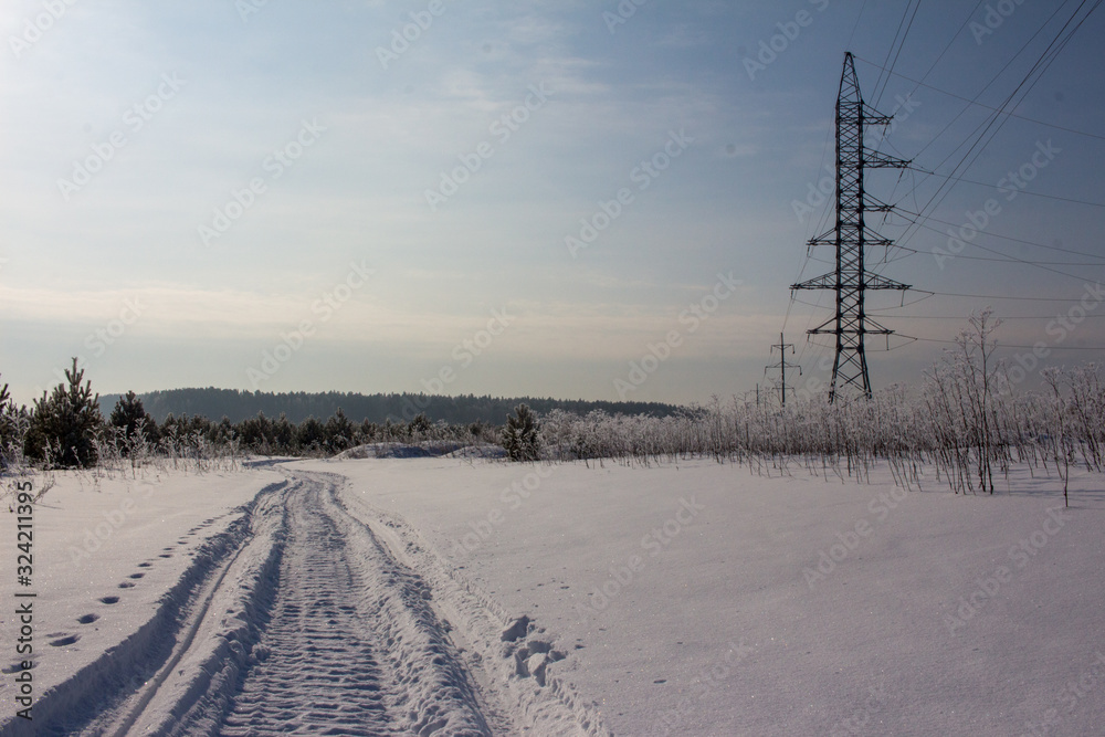 snowmobail trail at field covered by snow snowmobail trail at field covered by snow
