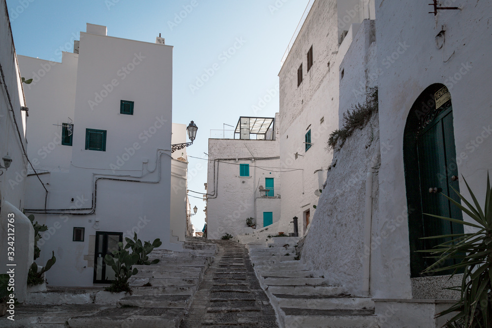 Historic center of white city of Ostuni in Puglia, in a day of August
