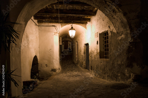 Alley in the ancient village of Rocca Imperiale, in Calabria, during a sunset of August