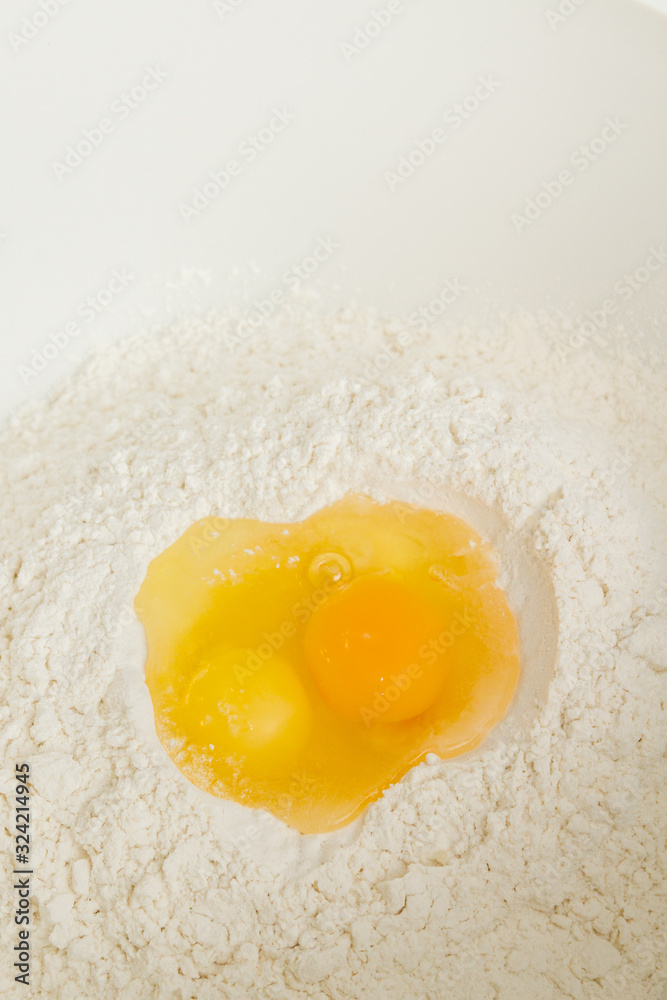 Cooking dough in a white plastic bowl at home Cooking dough in a white plastic bowl at home