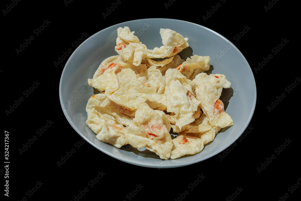 Fried Fish Dumplings put in the gray plate, in black background