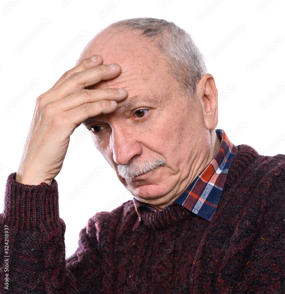 Sad lonely elderly man posing in studio on a white background Sad lonely elderly man posing in studio on a white background