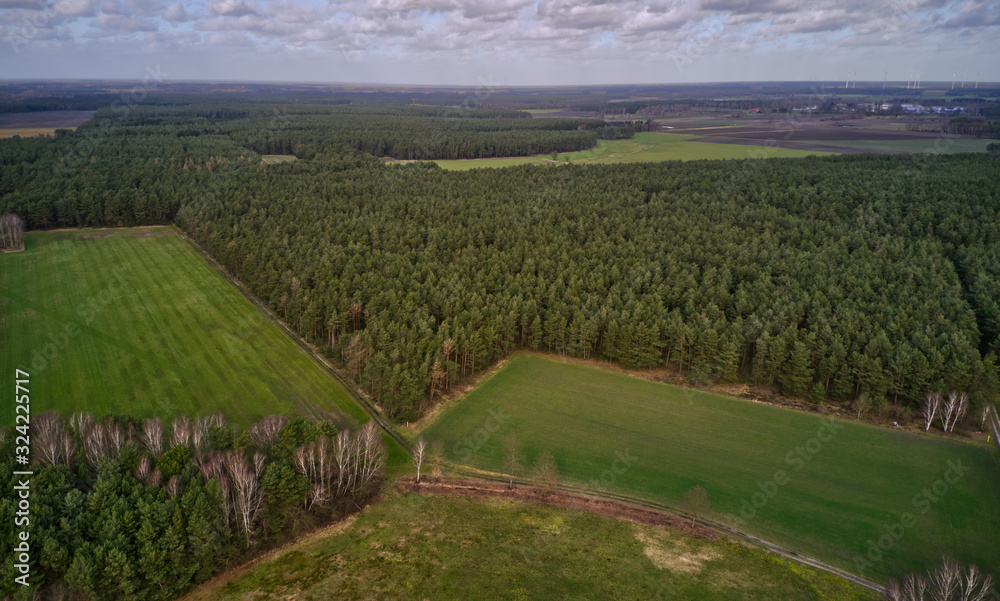Cultural landscape in the north of Germany with forests, meadows and fields, aerial view with the drone