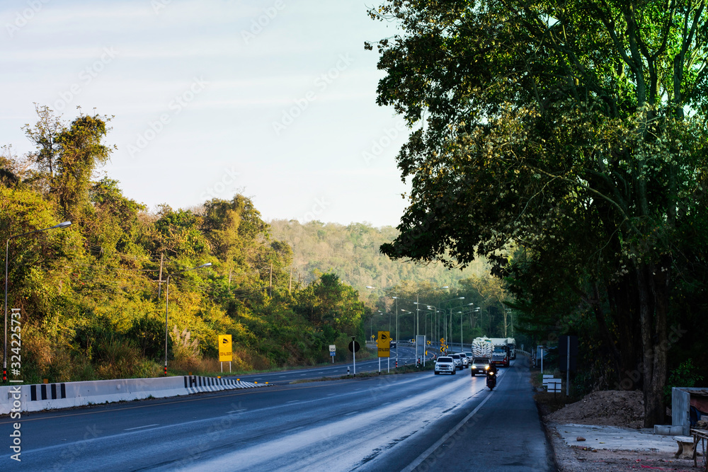 Obraz premium Beautiful green road in countryside, Landscape road with green forest, Main road on the mountain